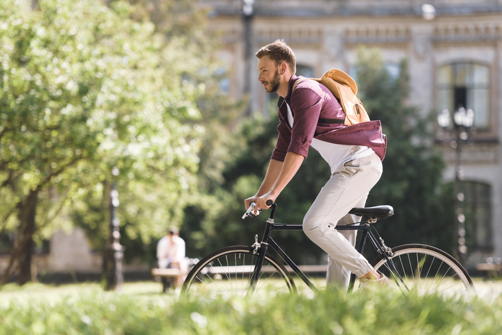 Staff member riding bike